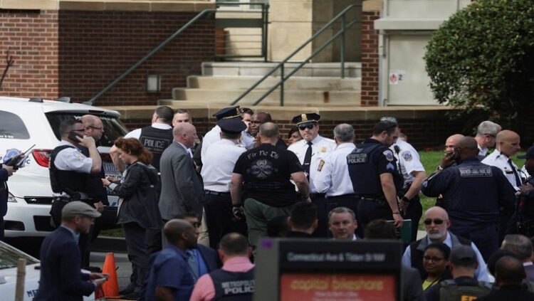 Washington, D.C. Metropolitan police and other law enforcement officers respond to the scene of a reported active shooter near Edmund Burke Middle School in the Cleveland Park neighborhood of Northwest Washington, U.S., April 22, 2022.
