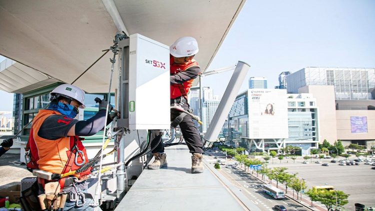 Engineers set up a 5G base station in Seoul, South Korea, May 31, 2019, in this handout picture provided by SK Telecom. Picture taken May 31, 2019. SK Telecom/Handout via REUTERS/Files