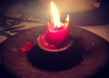 A candle burning during rolling blackouts.
