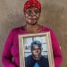 Ntombifuthi Dhladhla holds a photo of her late brother, Joseph Gumede, who was a patient at one of the Life Esidimeni facilities.