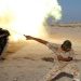 A fighter of Libyan forces allied with the UN-backed government fires a shell with Soviet made T-55 tank at Islamic State fighters in Sirte, Libya.