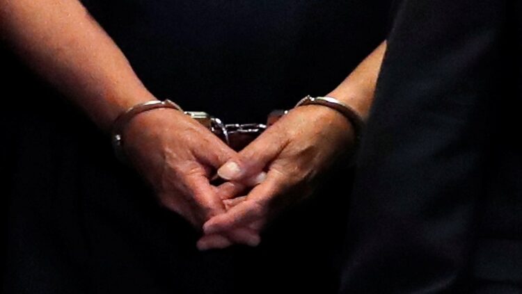 [File Image] A suspect shown in handcuffs