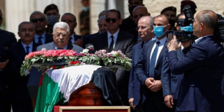 Palestinian President Mahmoud Abbas bids farewell to Al Jazeera journalist Shireen Abu Akleh, who was killed during an Israeli raid, in Ramallah in the Israeli-occupied West Bank May 12, 2022.