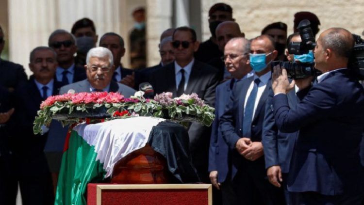 Palestinian President Mahmoud Abbas bids farewell to Al Jazeera journalist Shireen Abu Akleh, who was killed during an Israeli raid, in Ramallah in the Israeli-occupied West Bank May 12, 2022.