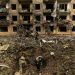 File image: Ukrainian military personnel inspect the site of a missile strike in front of a damaged residential building, amid Russia's invasion,  April 30, 2022.