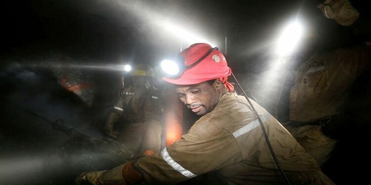 [File Image] Miners work deep underground at Sibanye Gold's Masimthembe shaft in Westonaria, South Africa, April 3, 2017.