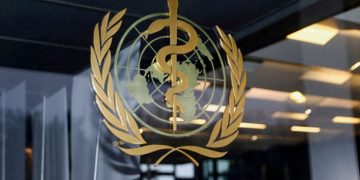 The World Health Organisation logo is pictured at the entrance of the WHO building, in Geneva, Switzerland, December 20, 2021.