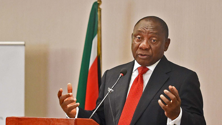 File image:  President Cyril Ramaphosa with the South African flag in the background.