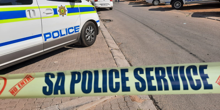 SAPS vehicles and police tape
