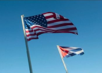 lags of U.S. and Cuba hang outside a hotel in Havana, Cuba, April 6, 2022.