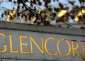 FILE PHOTO: The logo of commodities trader Glencore is pictured in front of the company's headquarters in Baar, Switzerland, November 20, 2012.