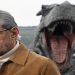 Cast member Jeff Goldblum conducts an interview near a model dinosaur during a photocall to promote the forthcoming film 'Jurassic World: Fallen Kingdom' in London, Britain, May 24, 2018.