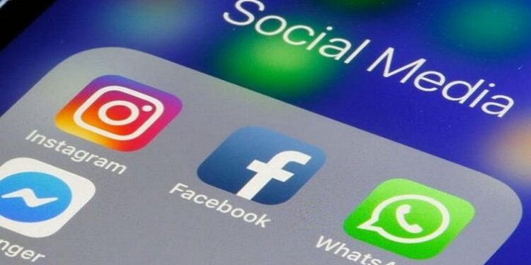 File image: Social media apps appear on a phone screen.