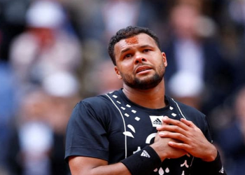 France’s Jo-Wilfried Tsonga reacts after playing his final match before retiring, after losing his first round match against Spaniard Pablo Carreno Busta at the French Open.