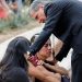 Gustavo Garcia-Siller, Archbishop of the Archdiocese of San Antonio, comforts people as they react outside the Ssgt Willie de Leon Civic Center, where students had been transported from Robb Elementary School after a shooting, in Uvalde, Texas, U.S. May 24, 2022