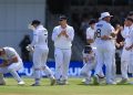England's Matthew Potts celebrates after taking the wicket of New Zealand's Daryl Mitchell .