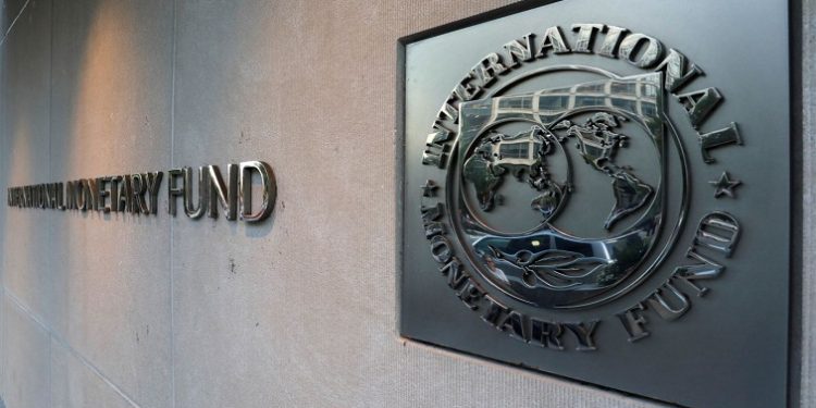 International Monetary Fund (IMF) logo is seen outside the headquarters building in Washington, U.S.