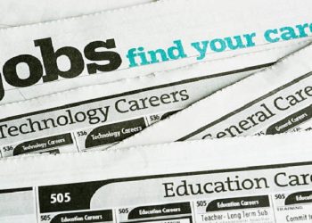 A newspaper with job listings.