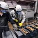 Employees process ingots of 99.99 percent pure gold at the Krastsvetmet non-ferrous metals plant in the Siberian city of Krasnoyarsk, Russia March 10, 2022.