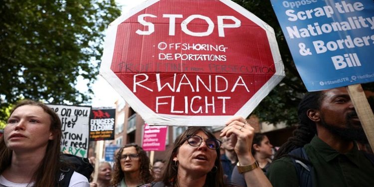 Protestors demonstrate outside the Home Office against the British Governments plans to deport asylum seekers to Rwanda, in London, Britain, June 13, 2022.