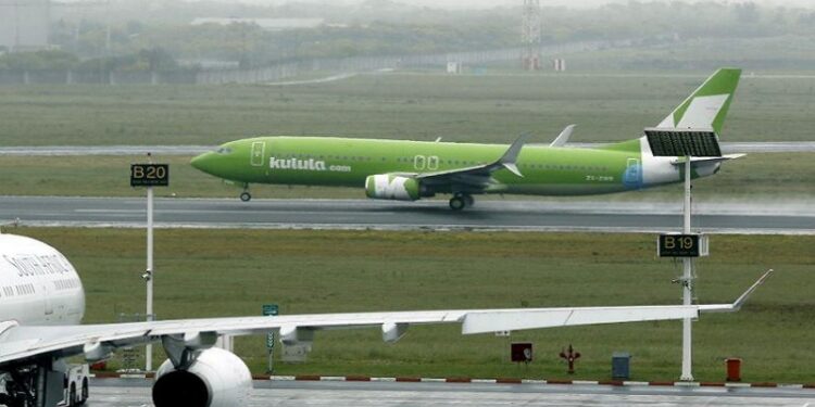 FILE PHOTO: An aircraft from South African low cost airline Kulula takes off from Cape Town International airport.
