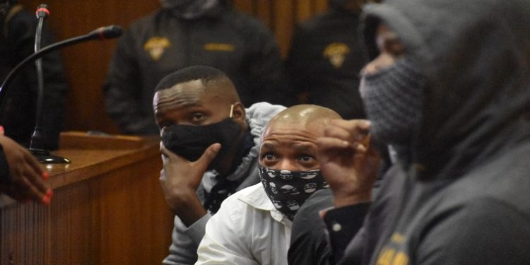 Third accused Mthobisi Prince Mncube (middle) sitting in the dock during the Senzo Meyiwa murder trial.