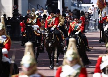 Britain's Prince Charles and Prince William ride on horseback during the Trooping the Colour parade in celebration of Britain's Queen Elizabeth's Platinum Jubilee, in London, Britain June 2, 2022. REUTERS/Henry Nicholls