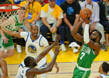 Boston Celtics guard, Jaylen Brown shoots the ball against Golden State Warriors in the NBA Finals.