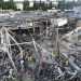Rescuers work at a site of a shopping mall hit by a Russian missile strike, as Russia's attack on Ukraine continues, in Kremenchuk, in Poltava region, Ukraine, in this handout picture released June 28, 2022.