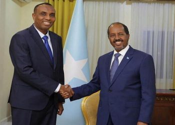 Somalia's President Hassan Sheikh Mohamud poses for a photograph with newly appointed Prime Minister Hamza Abdi Barre at the Presidential Palace in Mogadishu, Somalia June 15, 2022. Presidential Press Service/Handout via REUTERS