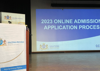 Gauteng Department of Education banner for online registrations on a stage.