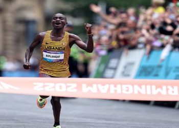 Commonwealth Games - Men's Marathon - Birmingham, Britain - July 30, 2022 Uganda's Victor Kiplangat celebrates as he crosses the line to win gold in the men's marathon.
