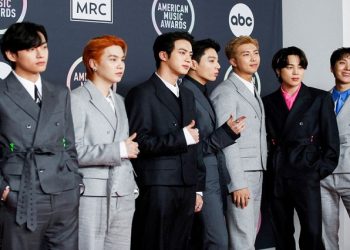 V, Suga, Jin, Jungkook, RM, Jimin and J-Hope of BTS arrive at the 2021 American Music Awards at the Microsoft Theater in Los Angeles.