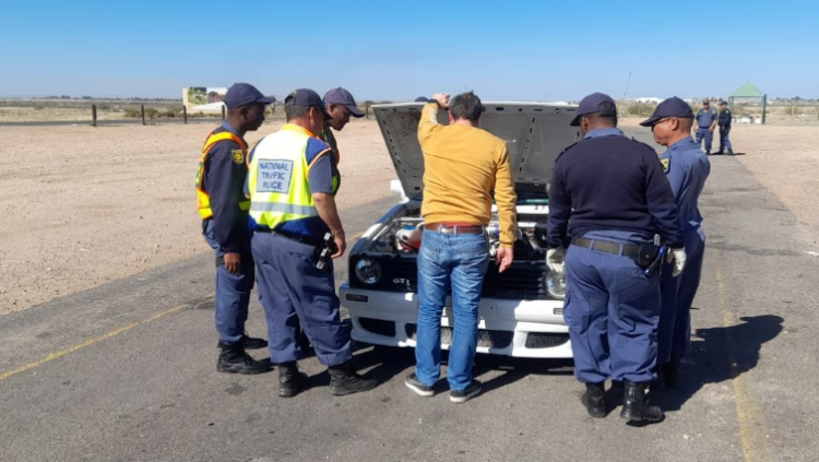 Police inspect a vehicle during  cross-border operations in the Northern Cape
