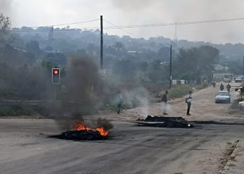 Burning tyres seen on a road during protests in Mpumalanga, 07 July 2022