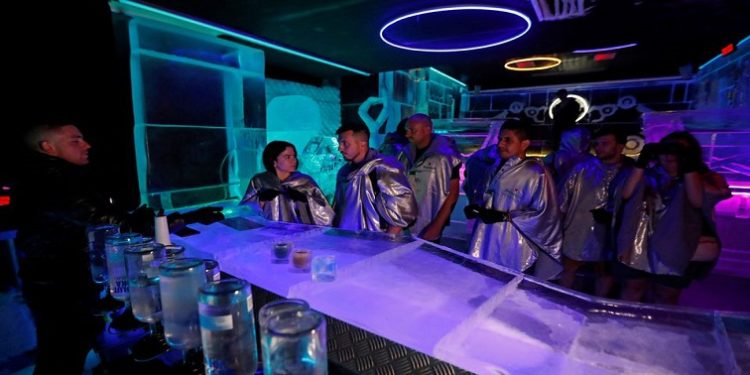 Customers wait to order a drink inside the Ice Pub in Prague, Czech Republic, July 19, 2022.