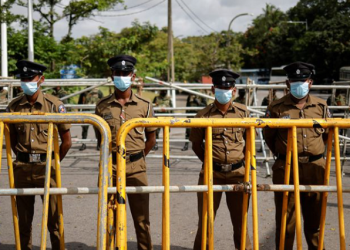 Security personnel stand guard outside the Parliament building, amid the country's economic crisis, in Colombo, Sri Lanka July 16, 2022.