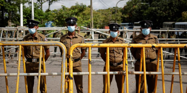 Security personnel stand guard outside the Parliament building, amid the country's economic crisis, in Colombo, Sri Lanka July 16, 2022.