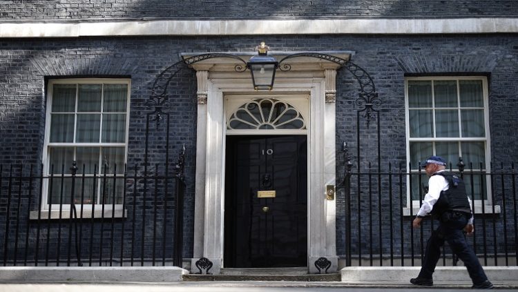 A police officer walks outside 10 Downing Street in London, Britain, June 24, 2022.