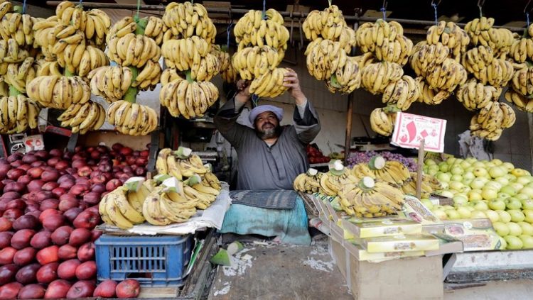 An Egyptian fruits seller works at a market in Cairo, Egypt, March 22, 2022.