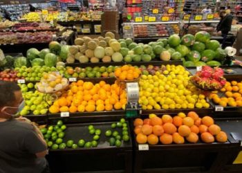A shopper browses for fruits at a grocery store, June 11, 2020.
