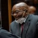 Former South African President Jacob Zuma speaks with his legal counsel in court during his corruption trial in Pietermaritzburg, South Africa, October 26, 2021.