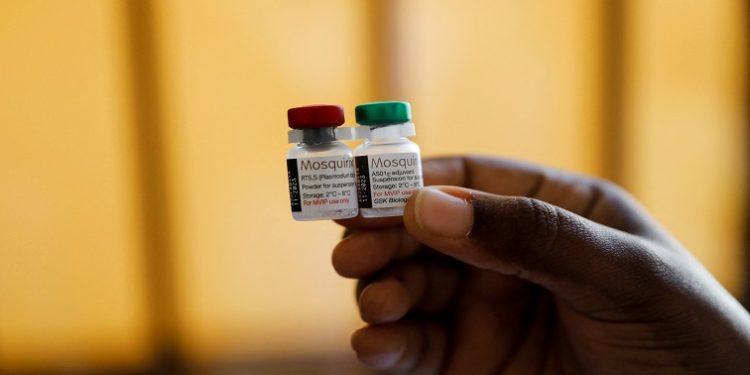 A nurse holds malaria vaccine vials before administering it to an infant at the Lumumba Sub-County hospital in Kisumu, Kenya, July 1, 2022.