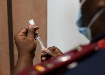 A nurse prepares a dose of the coronavirus vaccine in the Eastern Cape, November 2021.