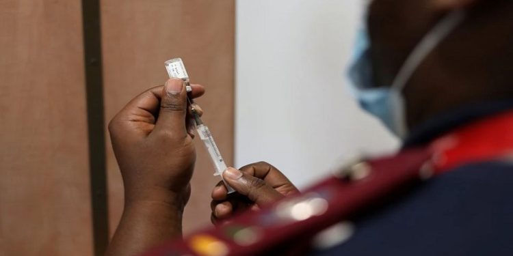 A nurse prepares a dose of the coronavirus disease (COVID-19) vaccine as the new Omicron variant spreads, in Dutywa, in the Eastern Cape province, South Africa November 29, 2021.