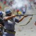 Police fire on demonstrators during a strike by farm workers at De Doorns on the N1 highway, linking Cape Town and Johannesburg, January 9, 2013.