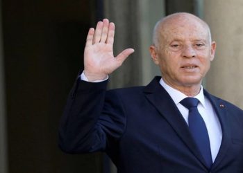 Tunisia's President Kais Saied waves as he is welcomed by French President Emmanuel Macron (not pictured) before a meeting at the Elysee Palace in Paris, France, June 22, 2020.