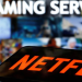 A smartphone with the Netflix logo lies in front of displayed "Streaming service" words in this illustration taken March 24, 2020. REUTERS/Dado Ruvic