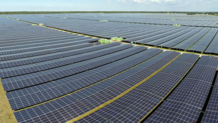 (File Image) A general view shows solar panels used to produce renewable energy.