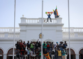 Protestors celebrate after entering the building of Sri Lanka's Prime Minister, Ranil Wickremesinghe.